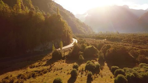 Aerial: Sunrise tracking shot in beautiful mountain valley Patagonia 2K