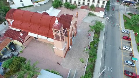 Aerial view of the central park of Huatulco, Oaxaca, Mexico. The city is La Crucecita downtown, poblational center of the resort The camera turns 360 around the tower of the Virgin of Guadalupe Church