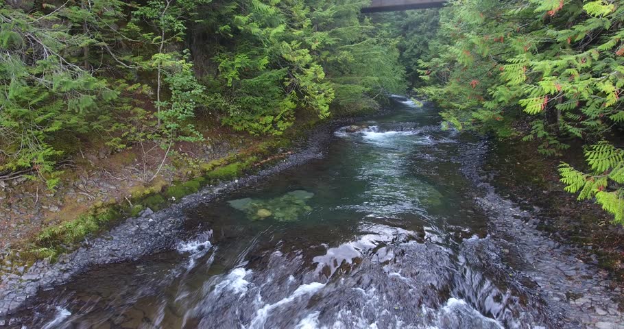 The beautiful Brandywine Falls, British Columbia. Picturesque flight from the top of the large waterfall and out showing the large amount of erosion