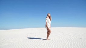 Evolving haired girl model looks in the desert