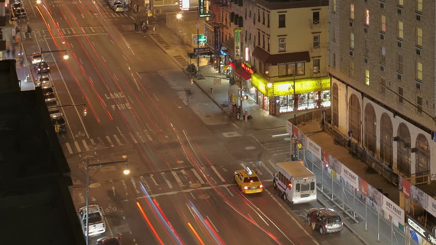 NEW YORK CITY - FEB 10: Timelapse of Traffic at night passing by on 8th Avenue