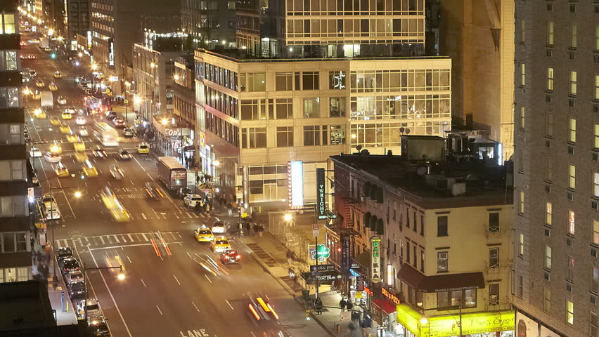 NEW YORK CITY  - Feb 10: Timelapse of Traffic at night passing by on 8th Avenue