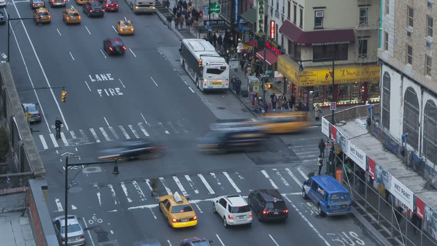 NEW YORK CITY - FEB 11: Timelapse of Traffic at sunset passing by on 8th Avenue