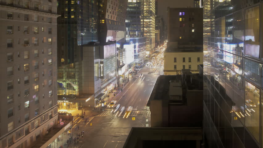 NEW YORK CITY - FEB 11: Timelapse of Traffic and reflection at night passing by