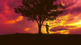 7 in 1 video! The man stand near the tree against the background of sunset. Time lapse