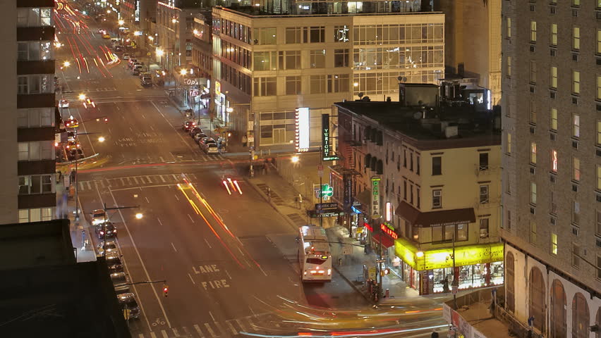 NEW YORK CITY  - Feb 10: Timelapse of Traffic at night passing by on 8th Avenue
