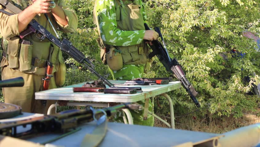 AK-47 Field stripping. Kalashnikov Disassembly and Reassembly. Soviet Spetsnaz (special operations) group prepares for a mission in Afghanistan