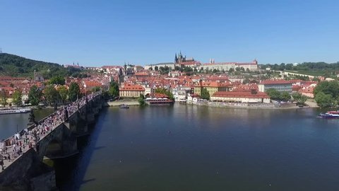 Prague city bridge over the river aerial view.