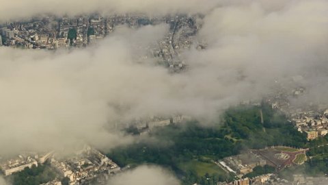 Clouds over the UK: Aerial footage featuring famous landmarks in central London, UK, including the Buckingham Palace, Royal Albert Hall, Kensington Gardens and Hyde Park