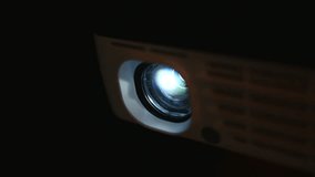 Closeup of a projector being used. This digital projector can be used to project a movie, business or school presentation or any entertainment.