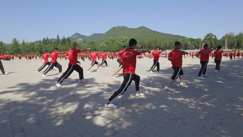 SHAOLIN, CHINA - MAY 2016: Martial arts students practice at the training grounds of a large institute in Wushu, the 'birthplace' of kung fu in central China
