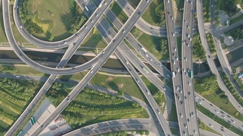 Panoramic aerial footage of a huge network of flyovers, junctions, intersections, roads, bridges etc in Zhengzhou, urban China.