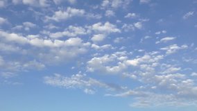 white clouds dissolving in blue sky - time lapse full hd video
