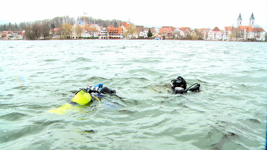 divers in a lake