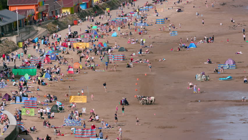 Familys Enjoying The Sunshine On Beach; North Bay Beach Scarborough