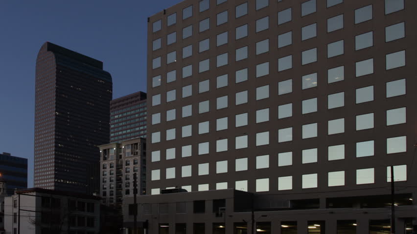 Bright sun reflects in the windows of a contemporary office building at Dawn. HD