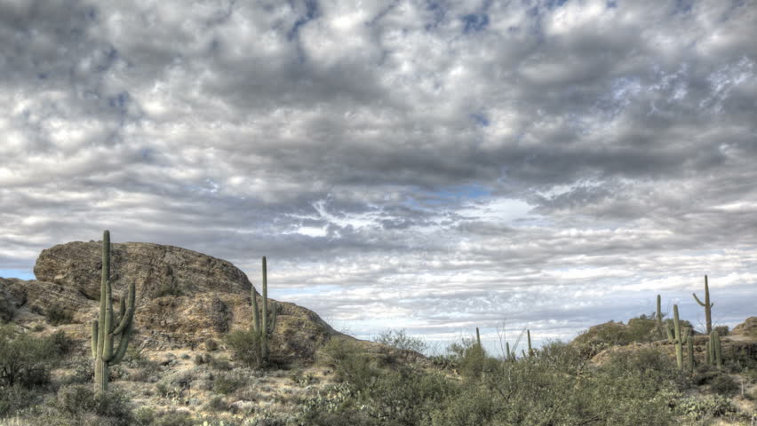 HDR Timelapse Javelina Rocks Saguaro NP Arizona with clouds passing by