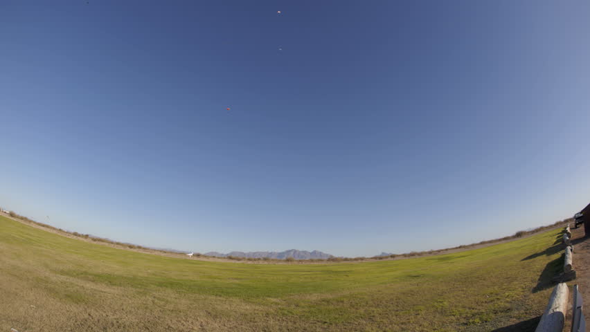 ARIZONA - NOV 26: (Time lapse view) Skydivers approaching and landing on