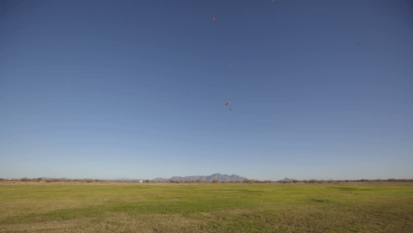 ARIZONA, USA - NOV 26: (Time lapse view) Skydivers approaching and landing on