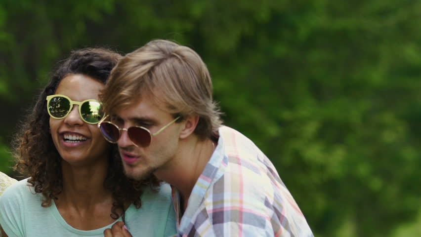 Happy students enjoying outdoor campus party, dancing, celebrating life, slowmo