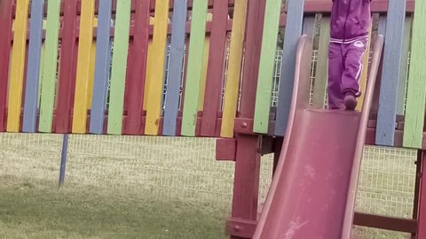 happy blonde little girl on playground. Slow motion 120 fps
