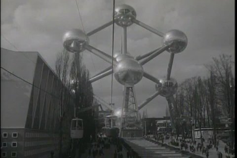 The Brussels World\xCDs Fair features a cable car sky ride, the American Pavilion and the Atomium building in 1958. (1950s)