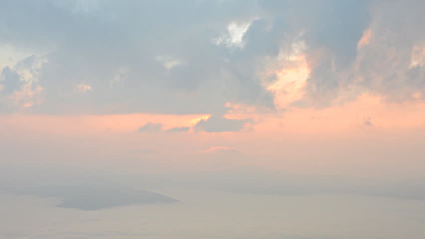 time lapse of sunrise, above the clouds, Clouds billowing.