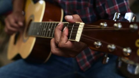 Man playing guitar.