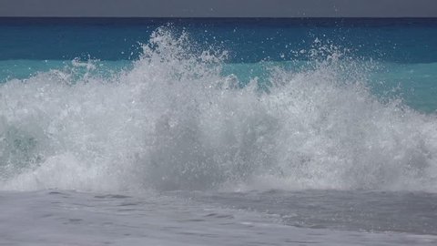 4K Greece Beach with Blue Waves Crashes on Seashore, Coastline View in Summer
