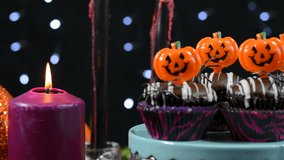 Halloween party table with chocolate cupcakes, close up pan. - Powered by Shutterstock - Get 15% off with code: PIKWIZARD15
