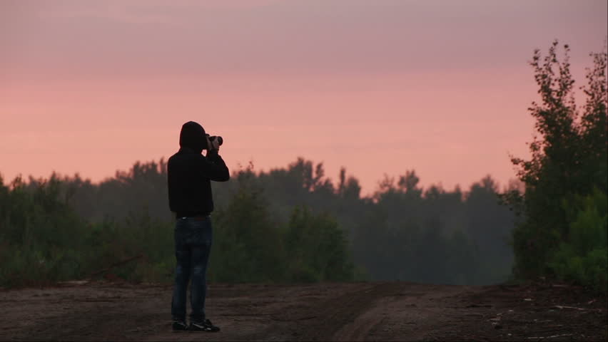 Silhouette of photographer taking photos