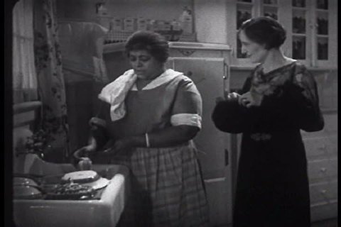 An African American maid gossips with the woman of the house, in a piece of romance fiction by Beatrice Burton Morgan, in 1935. (1930s)