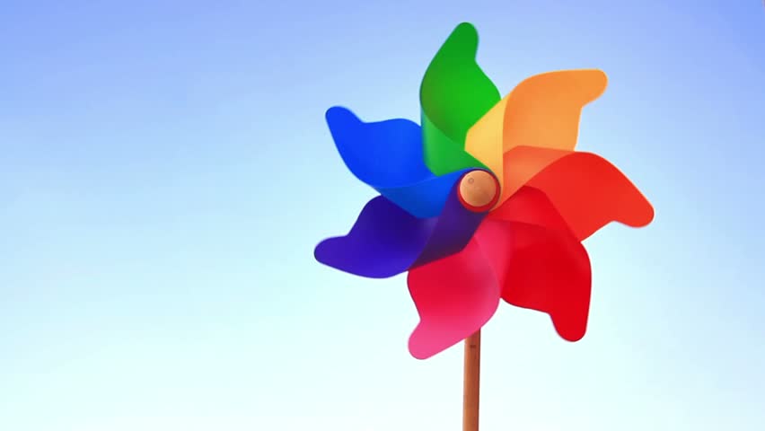 Spinning pinwheel toy against blue sky
