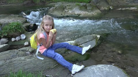 4K Girl Eating Apple by River, Child Relaxing at Camping on Mountains Trail