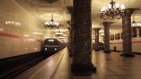 Soviet retro metro subway trains pass by beautiful station in Saint Petersburg Russia
