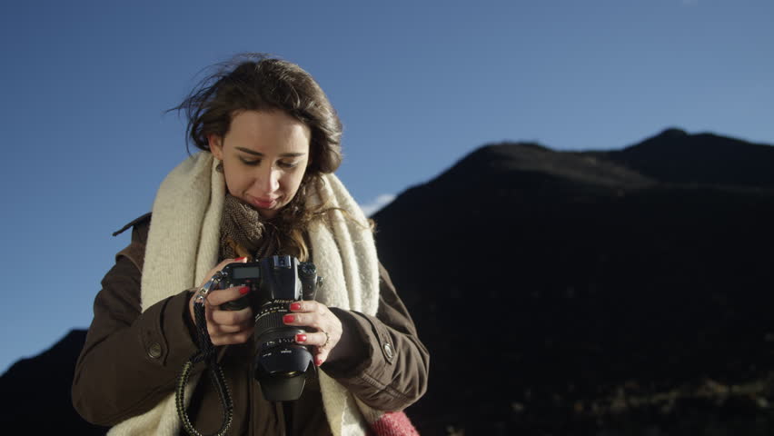 Photographer female looking at camera