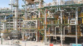 Oil refinery plant , Pipeline structure and machinery in process area of oil and chemical refinery plant , video movement panning style