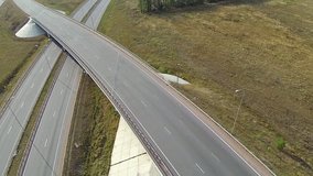Aerial shot of highway junction, drone follow the car