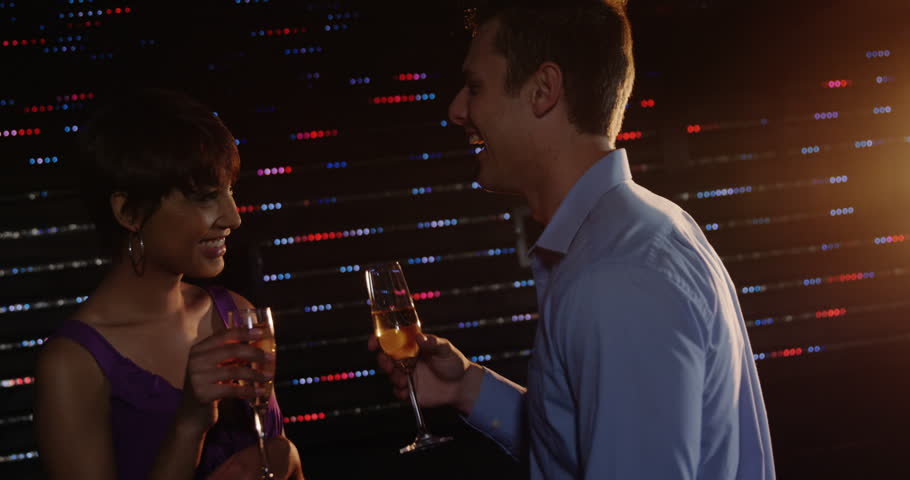 Affectionate couple drinking champagne while dancing in bar 4k