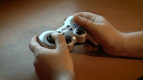 game controller in hands during the game - Powered by Shutterstock - Get 15% off with code: PIKWIZARD15