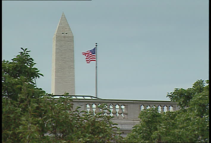 American Flag and top of Washington Monument 