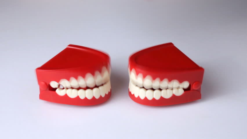 2 pair of clacking teeth talking to each other