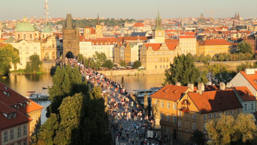 People on Charles bridge in sunset time, Prague, Czech Republic
