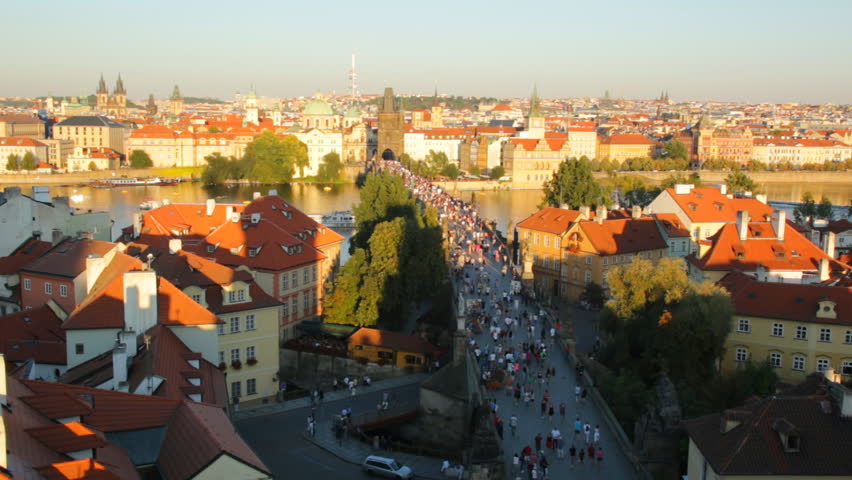 People on Charles bridge in sunset time, Prague, Czech Republic