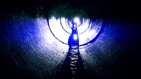 human silhouette in dark labyrinth tunnel looking for exit. - Powered by Shutterstock - Get 15% off with code: PIKWIZARD15