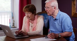 4k, Retired man and his wife going through documents, worried about savings - Powered by Shutterstock - Get 15% off with code: PIKWIZARD15