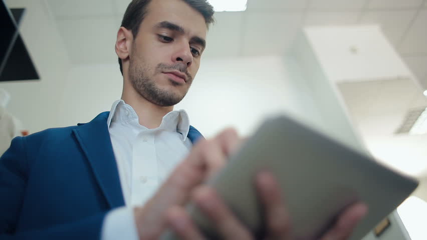 Man Working on Tablet Computer