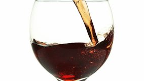 Red Wine being poured into Glass, against White Background, Slow motion