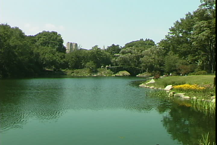 NEW YORK, NEW YORK, USA - CIRCA 2012: View of The Lake in Central Park and the Dakota in the background