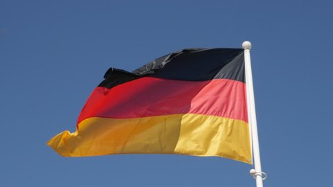 Germany national symbol waving in front of blue sky 4K 2160p 30fps UHD footage - Recognizable German flag on flag-pole floating on wind 3840X2160 UltraHD video
